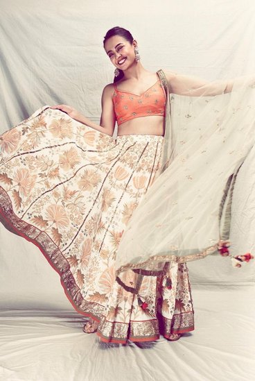 Surveen Chawla in orange lehenga