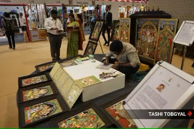 Artist making painting in craft bazaar