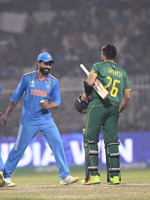 India's players greet South Africa's players after their match