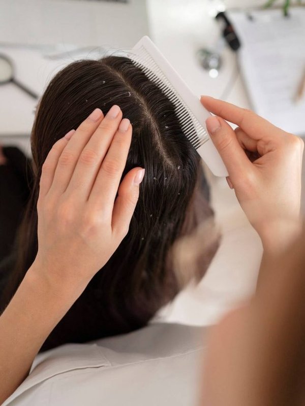 close-up-hand-using-comb_23-2149311379