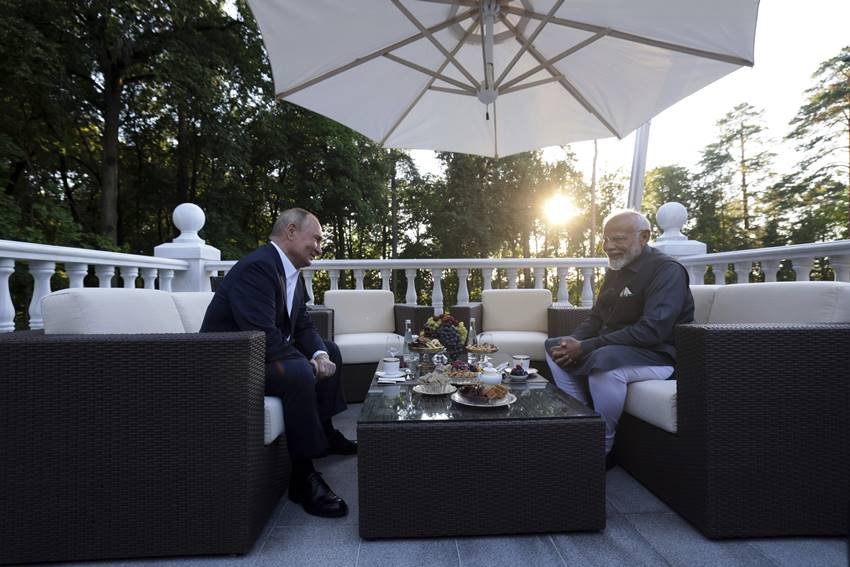 woman with pm modi and putin