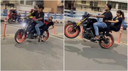 बाइक स्टंट करना पड़ा भारी, टायर पर फिसलते ही लड़की…; Viral Video देख निकल जाएगी चीख