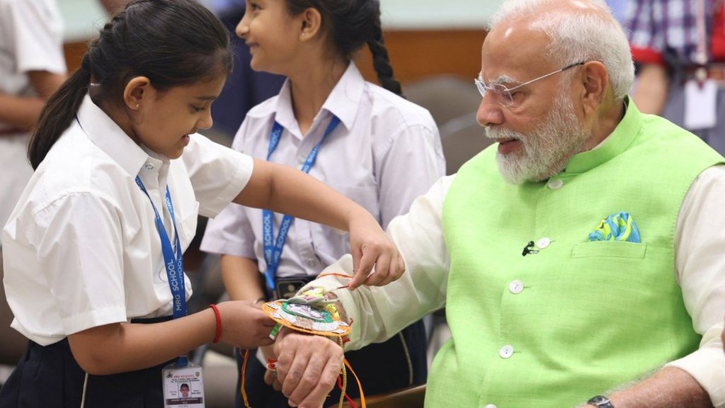 School students tie Rakhi to PM Narendra Modi, School students tie Special Rakhi to PM Modi,