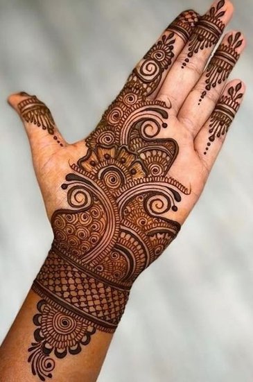 Bridal-style mehndi for Jivitputrika Vrat