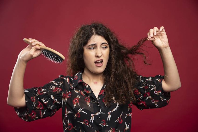 Due to deficiency of which vitamin hair falls?