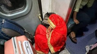 Indian Railway, woman sitting near toilet in train
