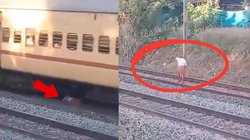 अचानक सामने आ गई ट्रेन, जान बचाने के लिए शख्स ने लगाया हैरान करने वाला जुगाड़, लूंगी लपेटी और चल पड़ा, Video Viral