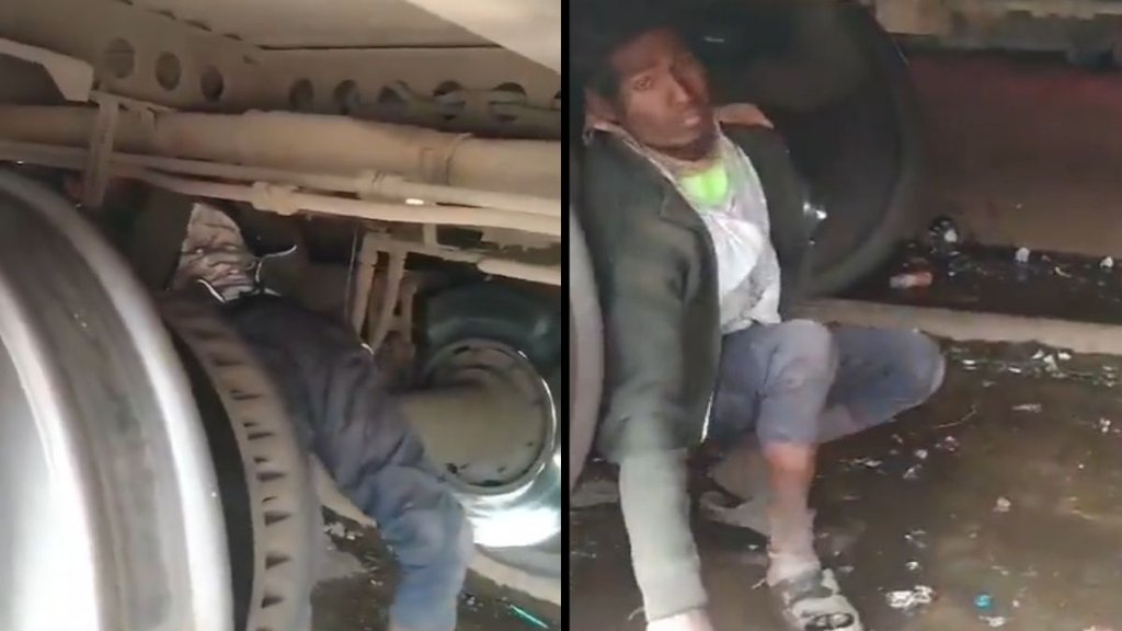 man travel beneath train, man travel underneath train