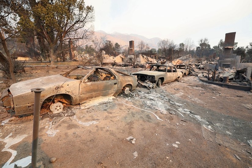 Burned vehicles lie
