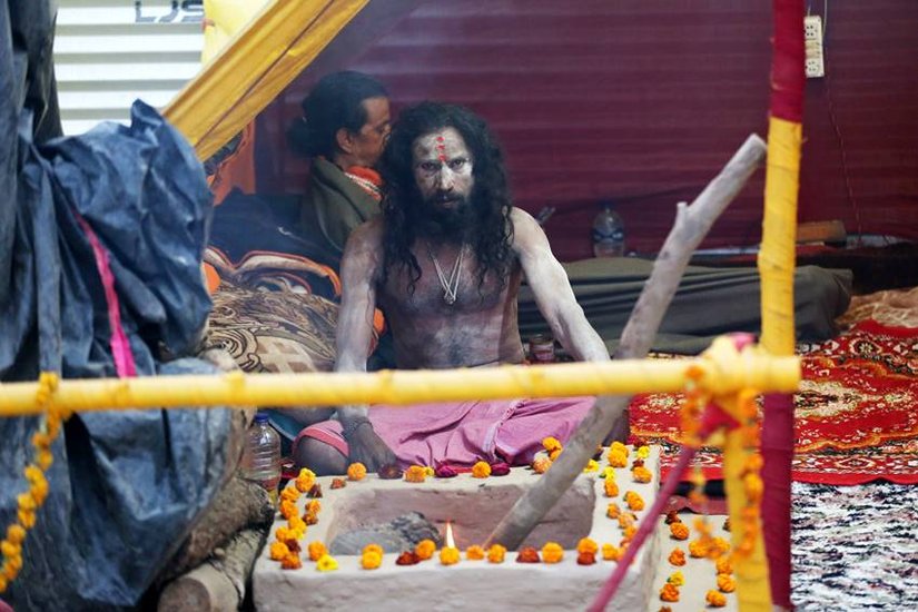 Why do Aghori live in crematorium