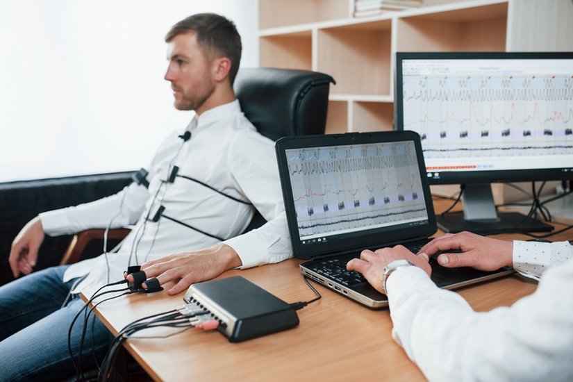 Suspicious man passes lie detector in the office