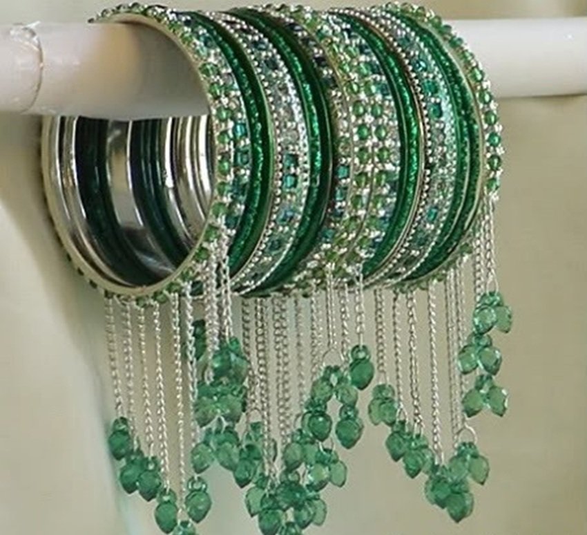 4 Combination of silver or oxidised bracelet with green bangles