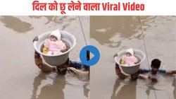 बारिश के बाद डूब गया इलाका, गले तक पानी में सिर पर बेटे को लेकर जाते दिखे पिता, Viral Video देख यूजर्स बोले – पापा तो हीरो हैं पर…