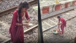 कहीं निकल ना जाए ट्रेन, बिजली-सी फूर्ती से खीरा छीलते दिखी पटरियों पर खड़ी महिला, Viral Video देख आखें हो जाएंगी नम