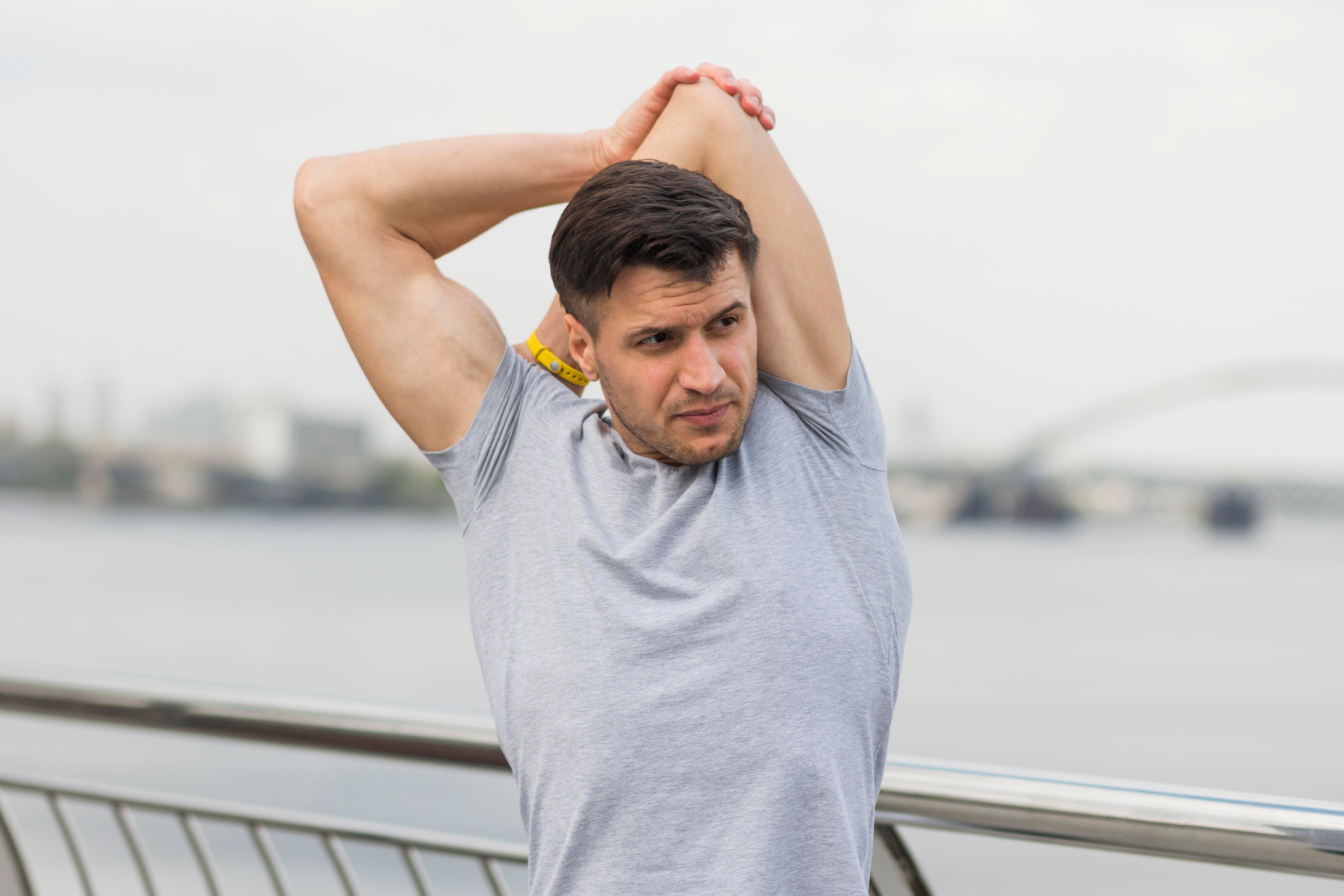portrait-adult-male-stretching-outdoors
