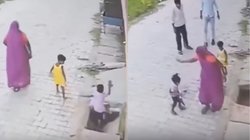 चलते-चलते सड़क किनारे नाले में गिरा बच्चा, अम्मा ने फटाफट निकाला बाहर और फिर जो किया, Viral Video देख यूजर्स दंग