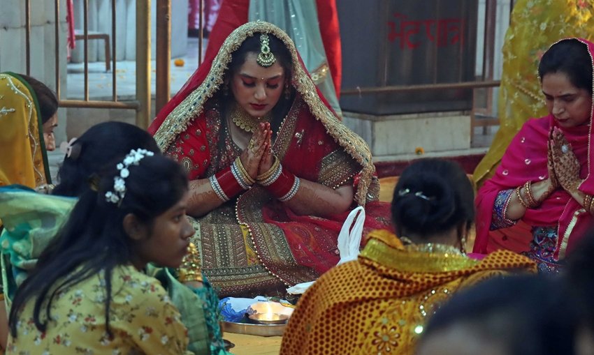 Women performing Karwa Chauth Puja at one of the Temple in Sector 15 Chandigarh on Wednesday. Express Photo by Kamleshwar Singh 01112023 *** Local Caption *** Women performing Karwa Chauth Puja