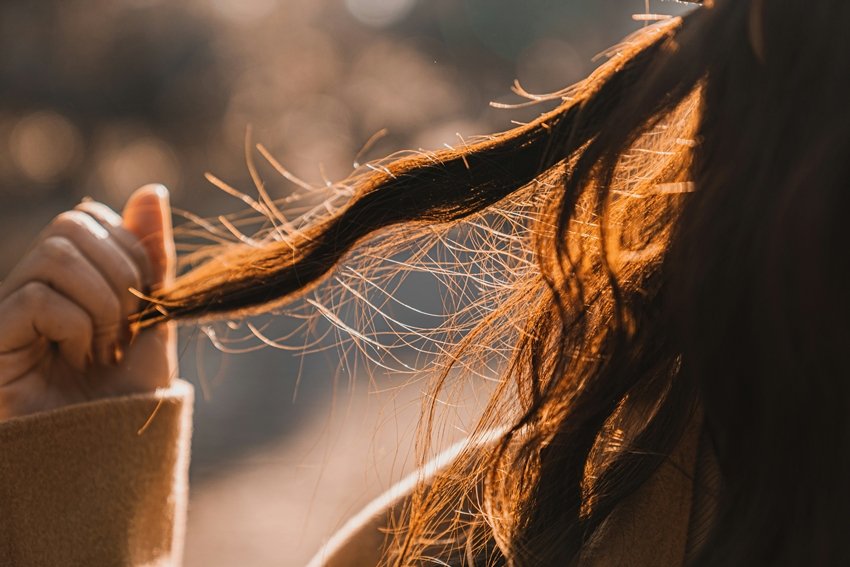 Sweat and oil buildup can trigger dandruff and infections