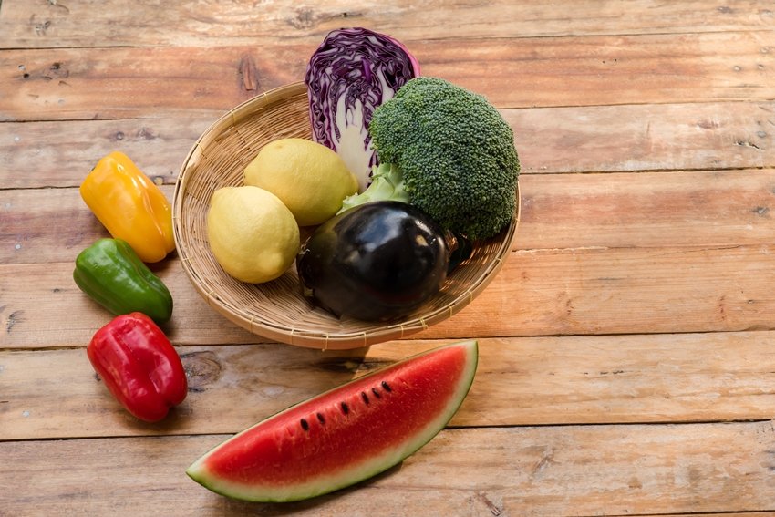 Various fruits with vegetable on wood background