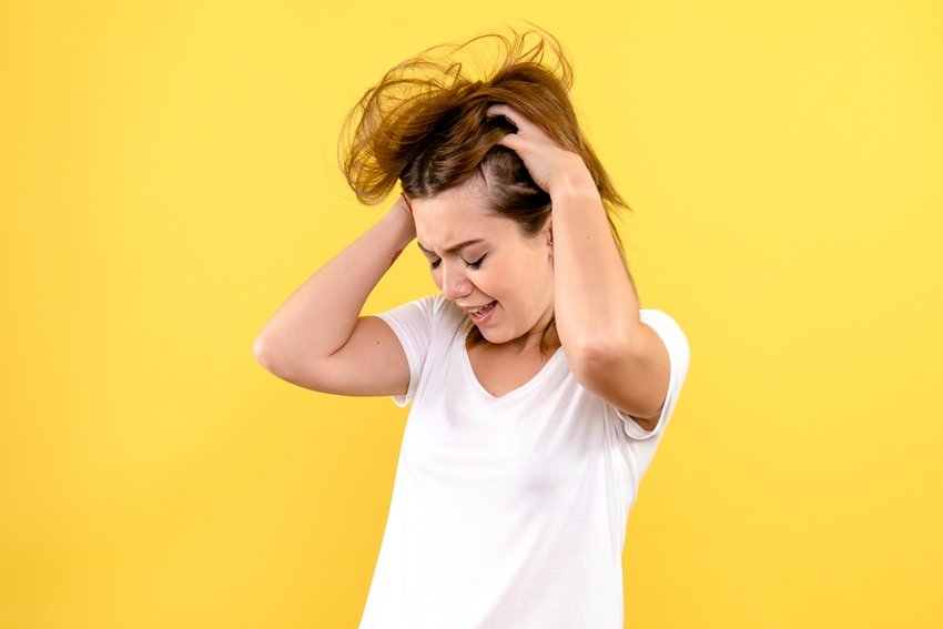 front view young female stressed on yellow background color woma