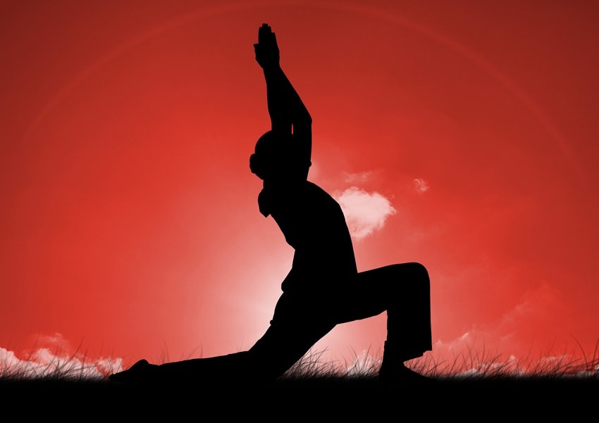  woman practicing yoga on grass against sky background