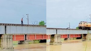 Man narrowly escapes while shooting reel on railway overbridge Shocking viral Video