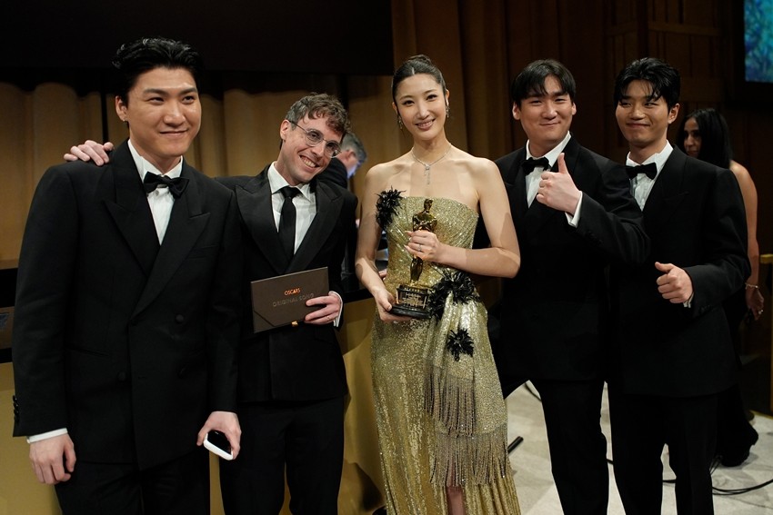 Joong Gyu Kwak, from left, Mark Sonnenblick, EJAE, Hee Dong Nam, and Yu Han Lee, winners of the award for best music