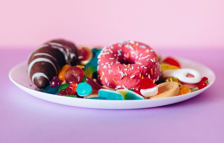 EATING A DIET HIGH IN SUGAR AND PROCESSED FOODS