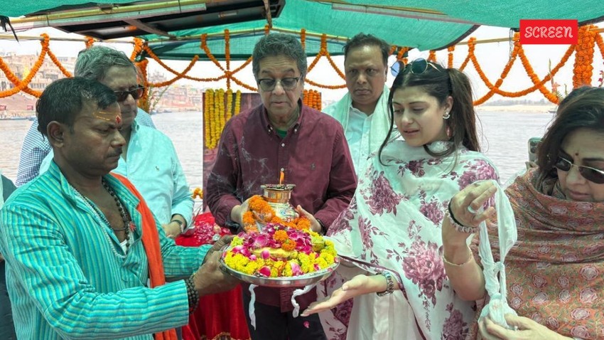 Anand and Zanai Bhosle immerse Asha Bhosle’s ashes in Varanasi.