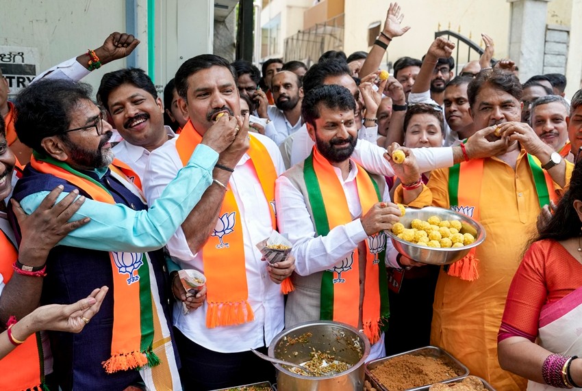 leaders and workers celebrate poll leads